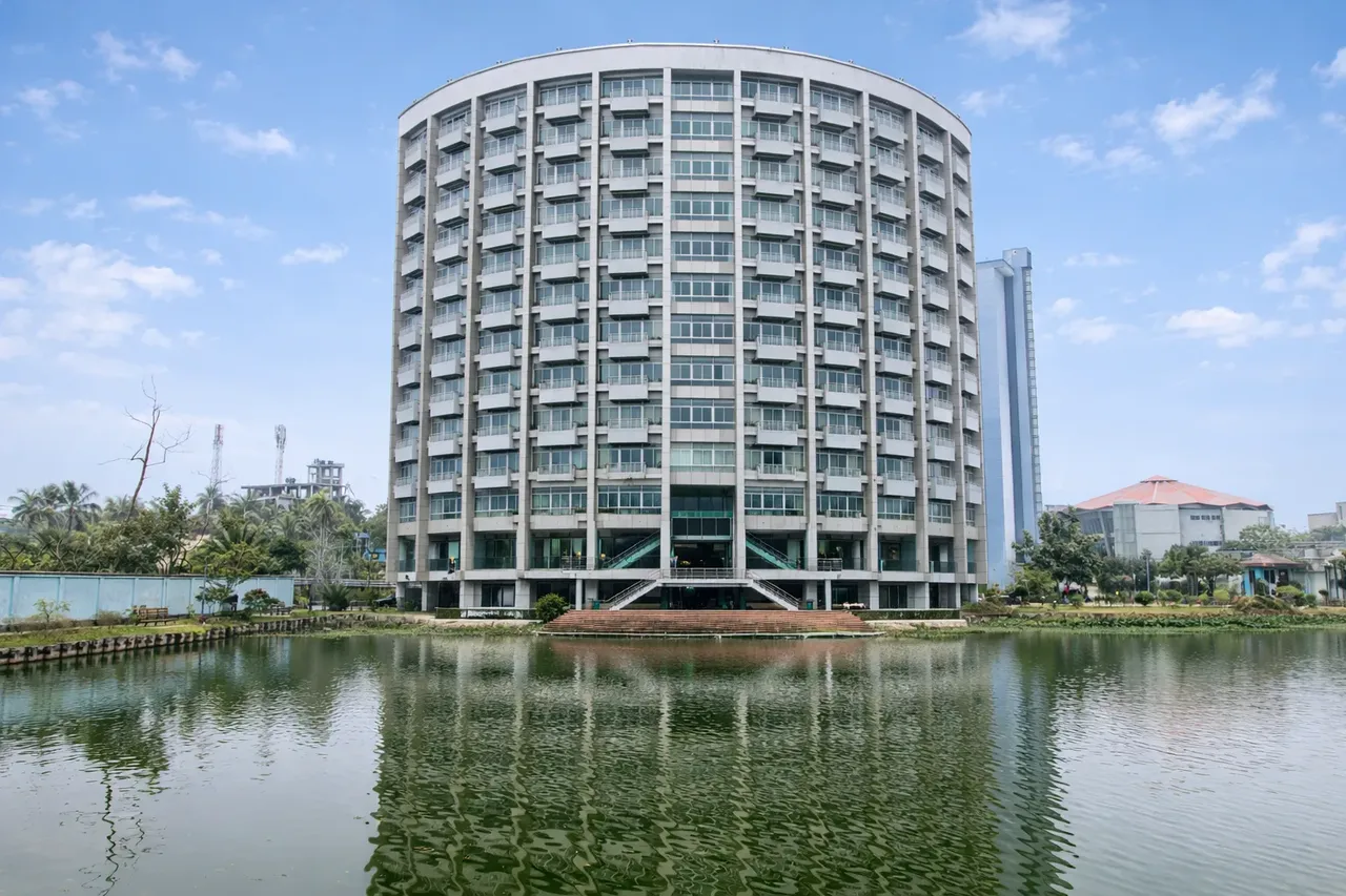 Round hotel block reflected in the lake