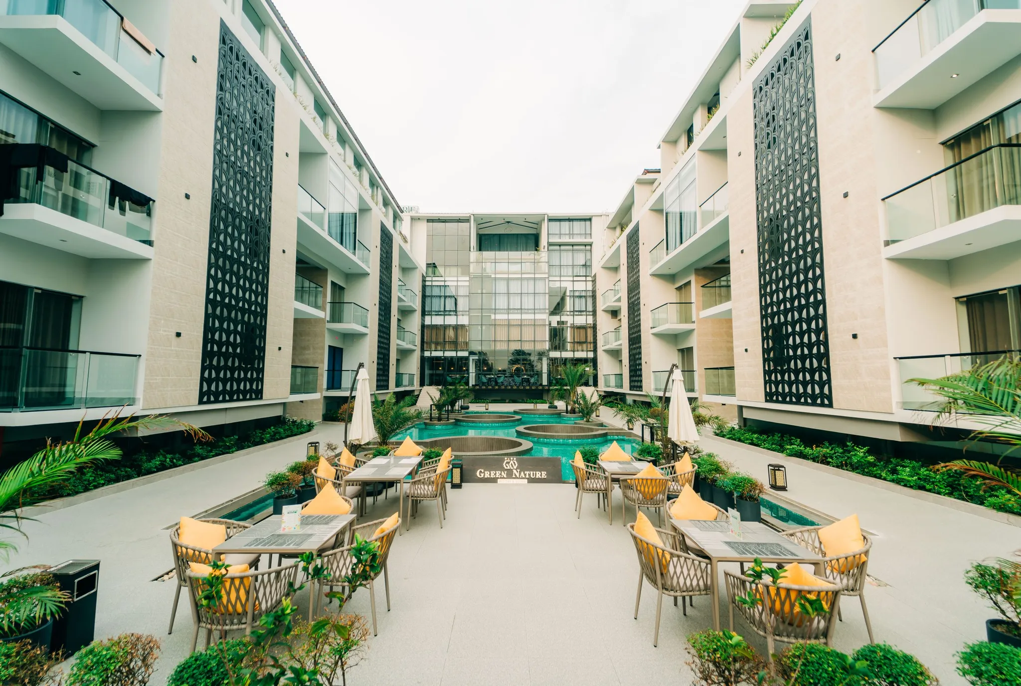 Courtyard with pool and terraces at Green Nature Resort & Suites