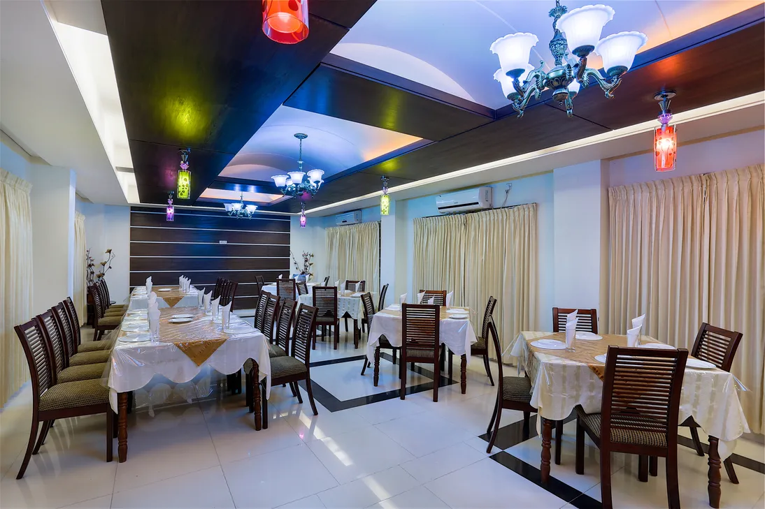 Restaurant with set tables and chandeliers
