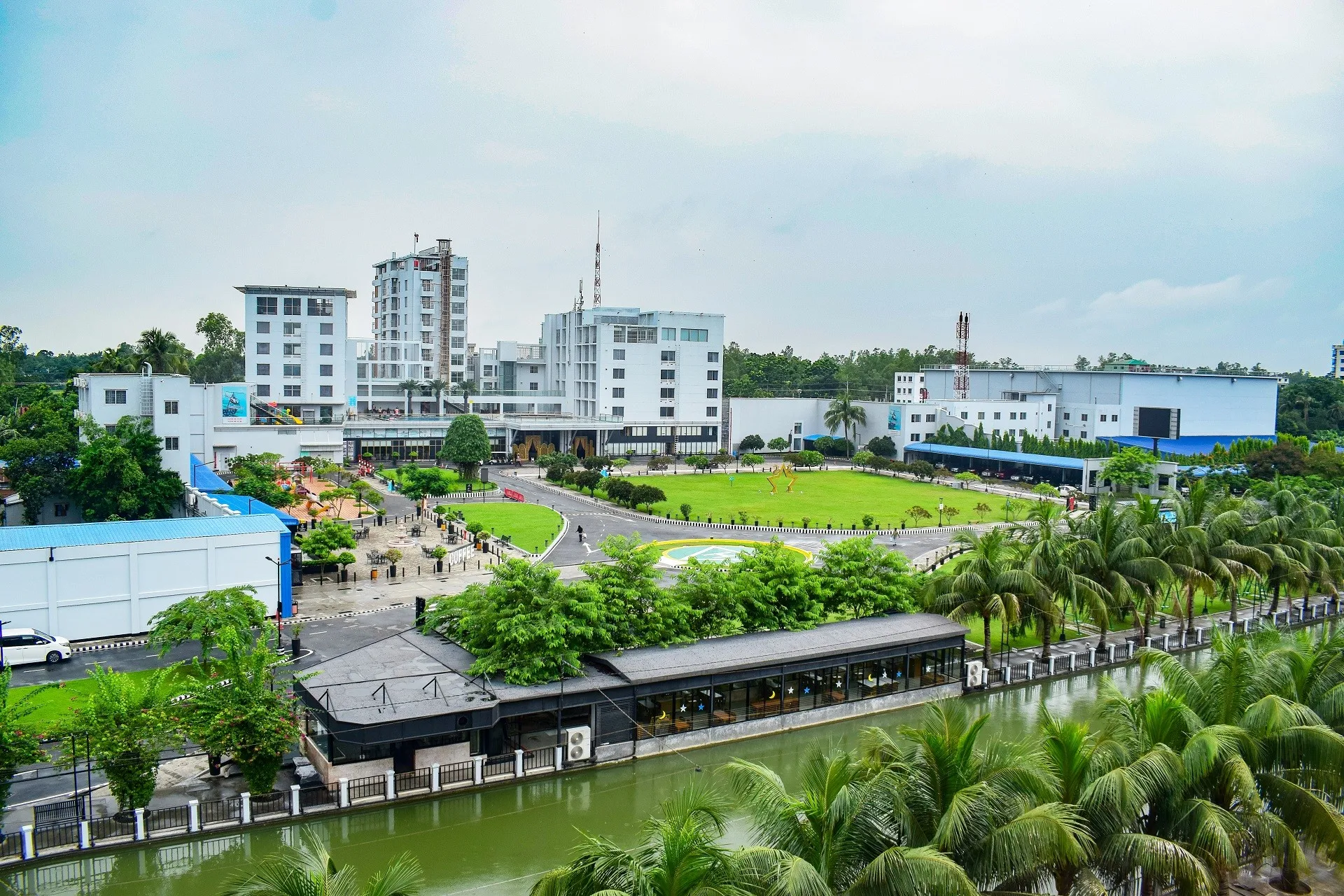 Aerial view of the resort buildings, lawns and lake