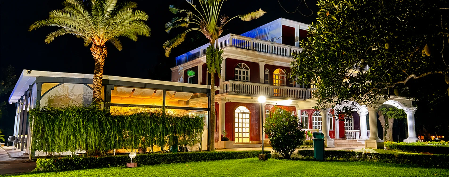 Kazi Resort villa lit up at night