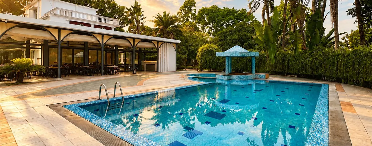 Swimming pool with poolside cabana at Kazi Resort