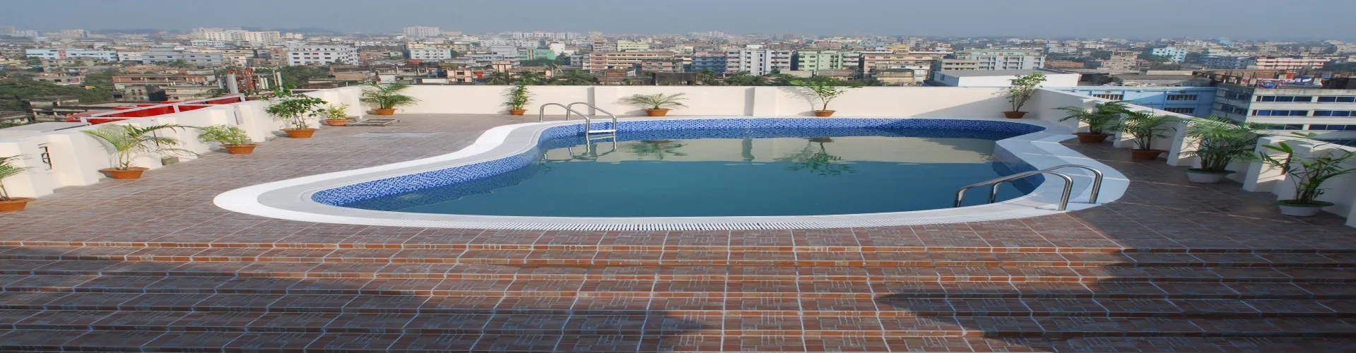 Rooftop swimming pool overlooking Agrabad at Orchid Business Hotel