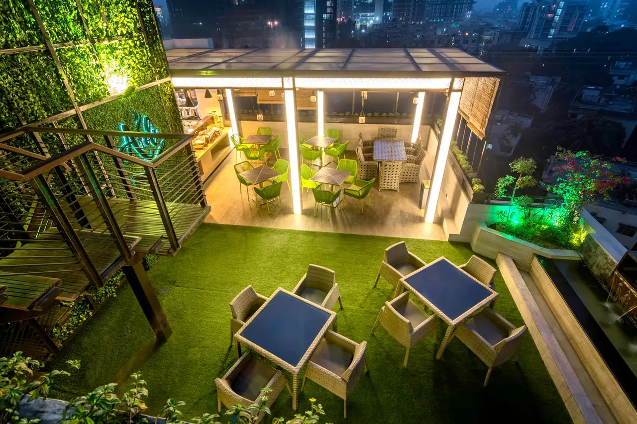 Garden terrace lit at night at The Raintree Dhaka