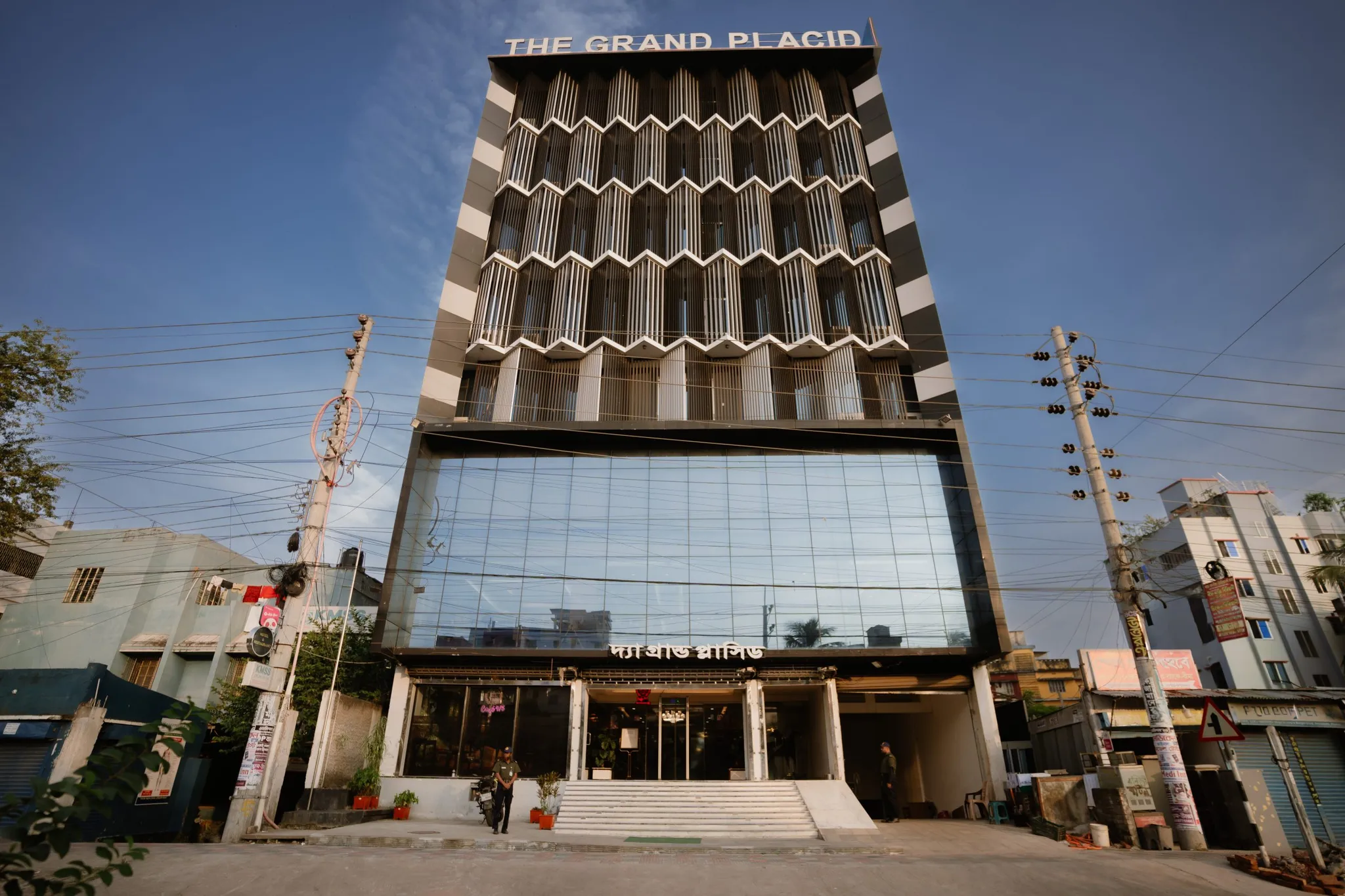 Hotel tower facade on Sher-E-Bangla Road at dusk