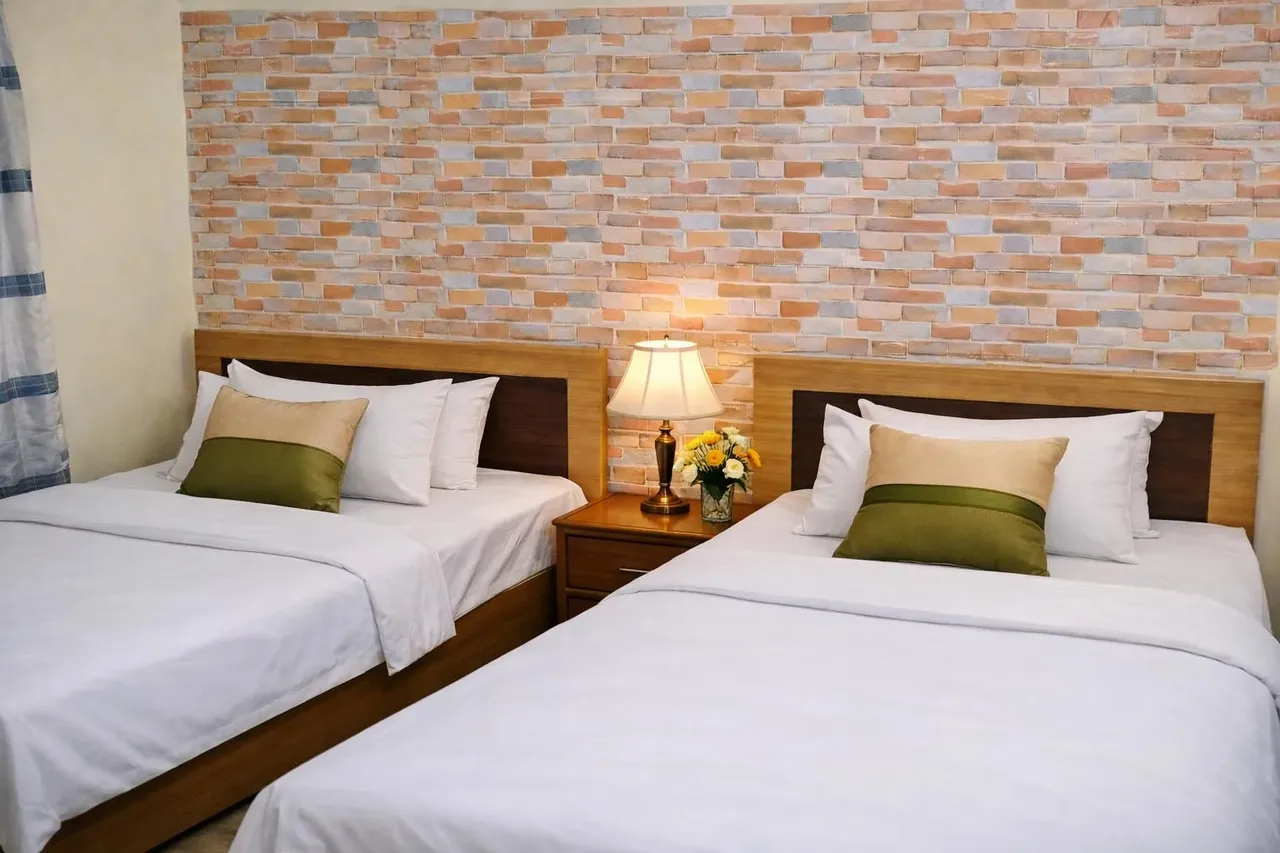 Twin guest room with brick-pattern walls