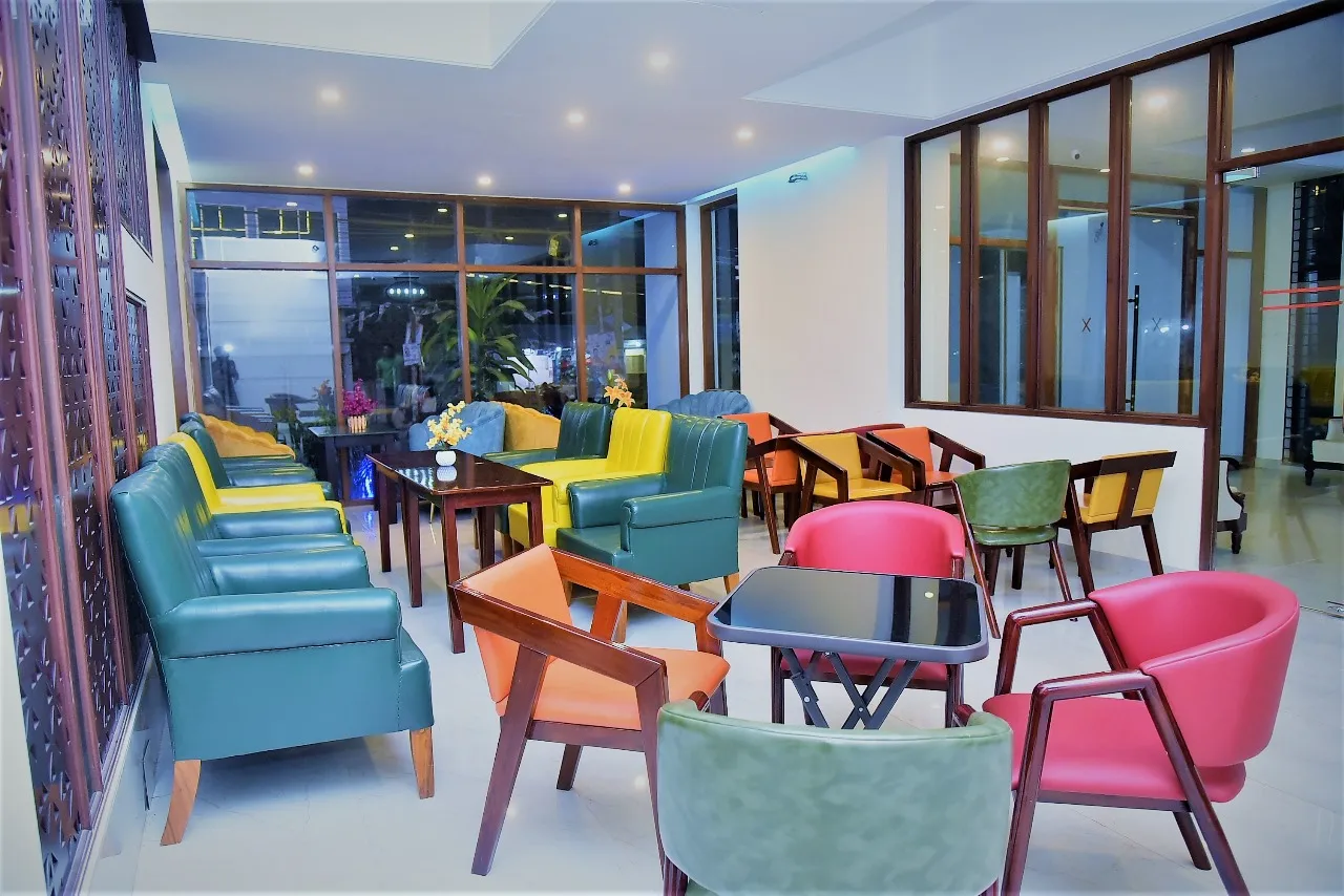Café with colourful chairs and tall windows