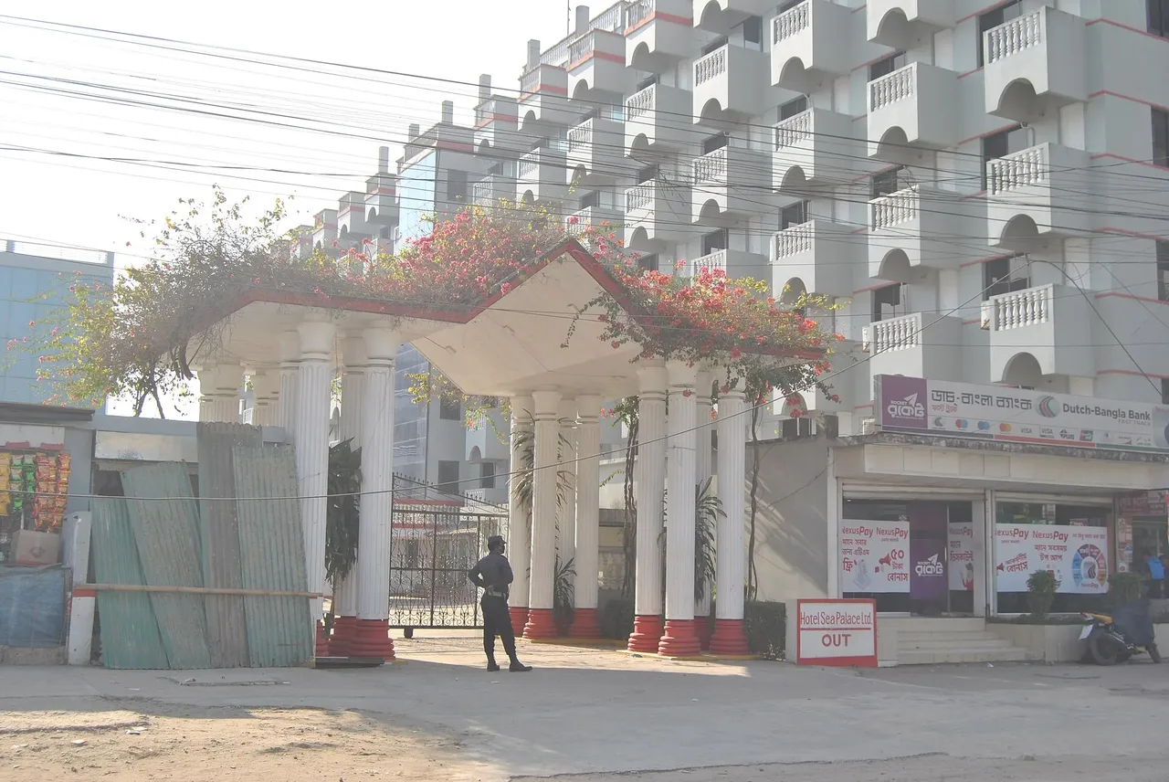 Entrance gate and white balconied block of Hotel Sea Palace Limited
