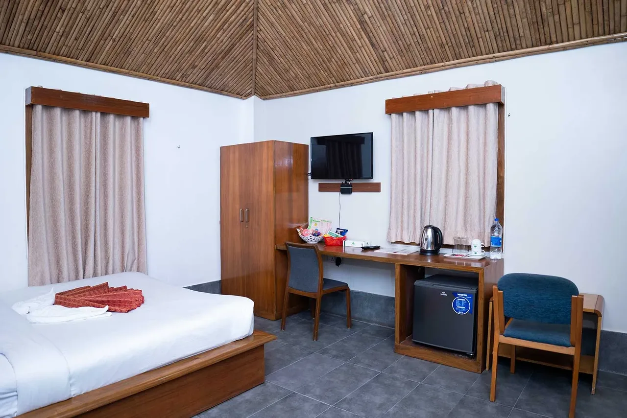 Couple Cottage bedroom with a king bed and desk