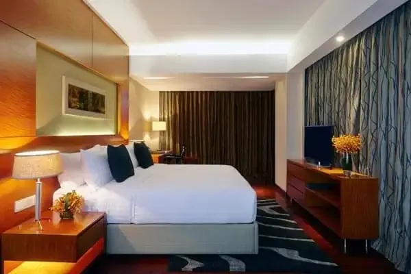 Deluxe room with a king bed at Amari Dhaka