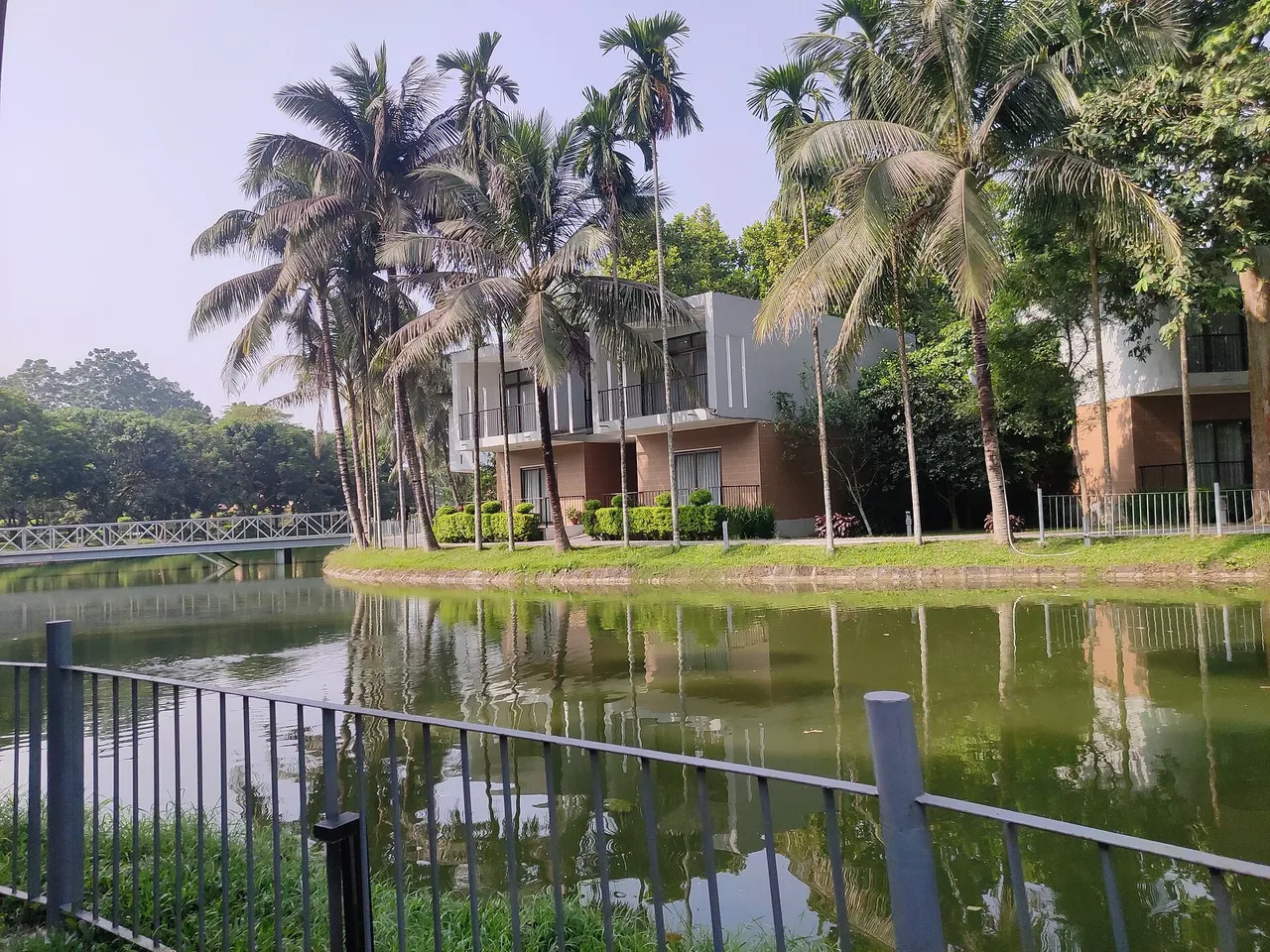 Lake and villas among palm trees at Dream Square Resort