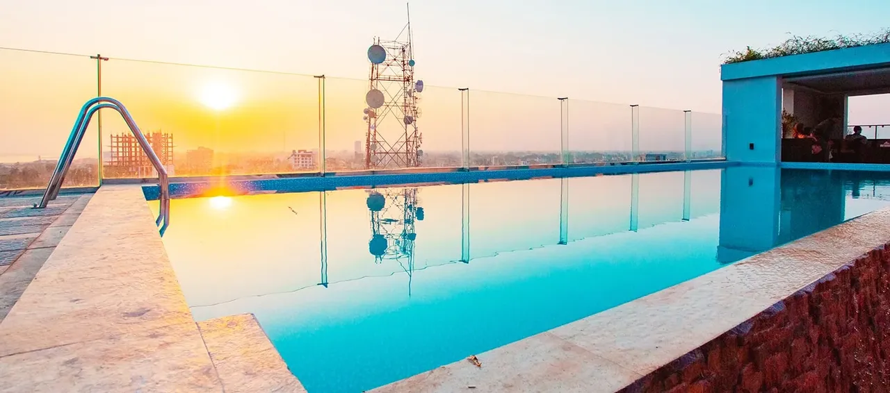 Rooftop swimming pool at sunset