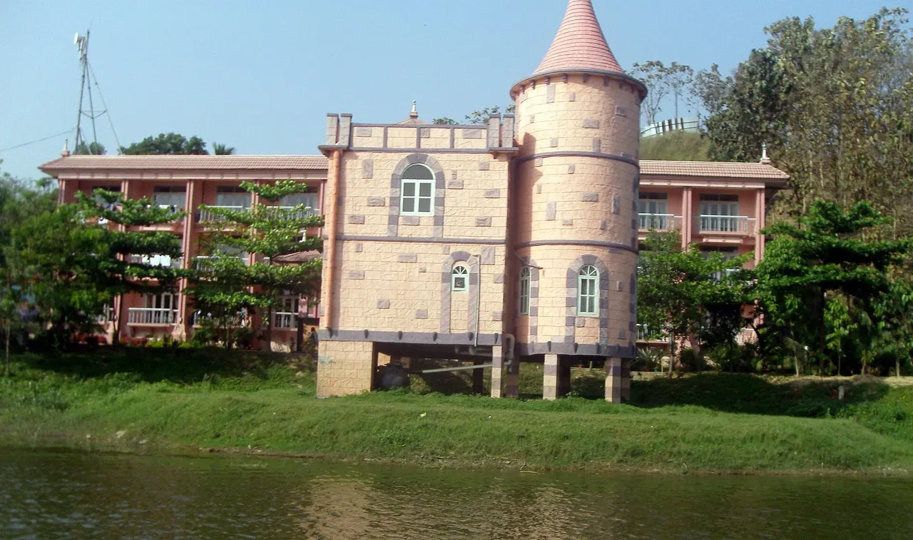 Turreted pavilion and resort wing on the edge of Foy's Lake