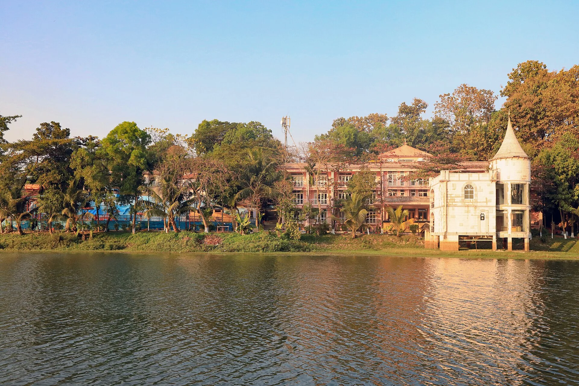 Foy's Lake Resort buildings and turreted pavilion seen across the lake