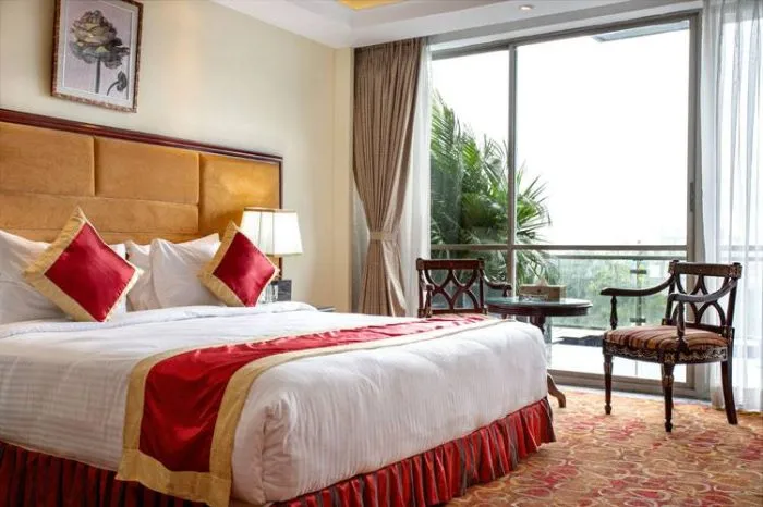 Grand Suite bedroom with a balcony window