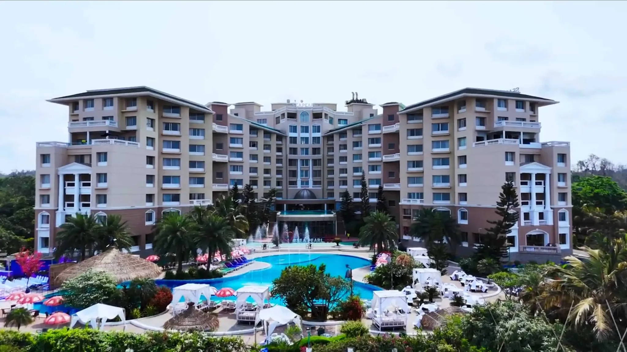 Main building of Sea Pearl Beach Resort & Spa above the pool and gardens