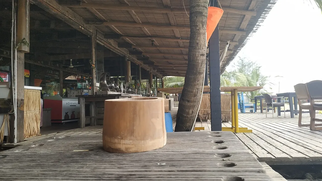 Open-air wooden deck of the restaurant at Mermaid Beach Resort