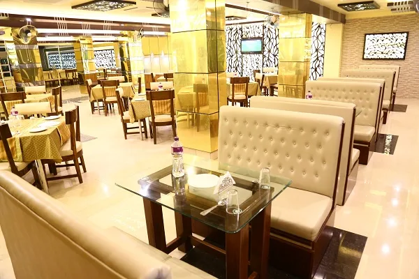 Restaurant with cushioned booth seating and gold-clad pillars