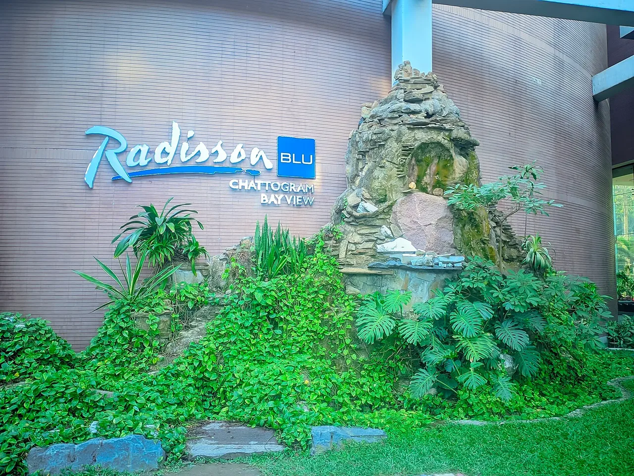 Radisson Blu sign and rock garden at the hotel entrance