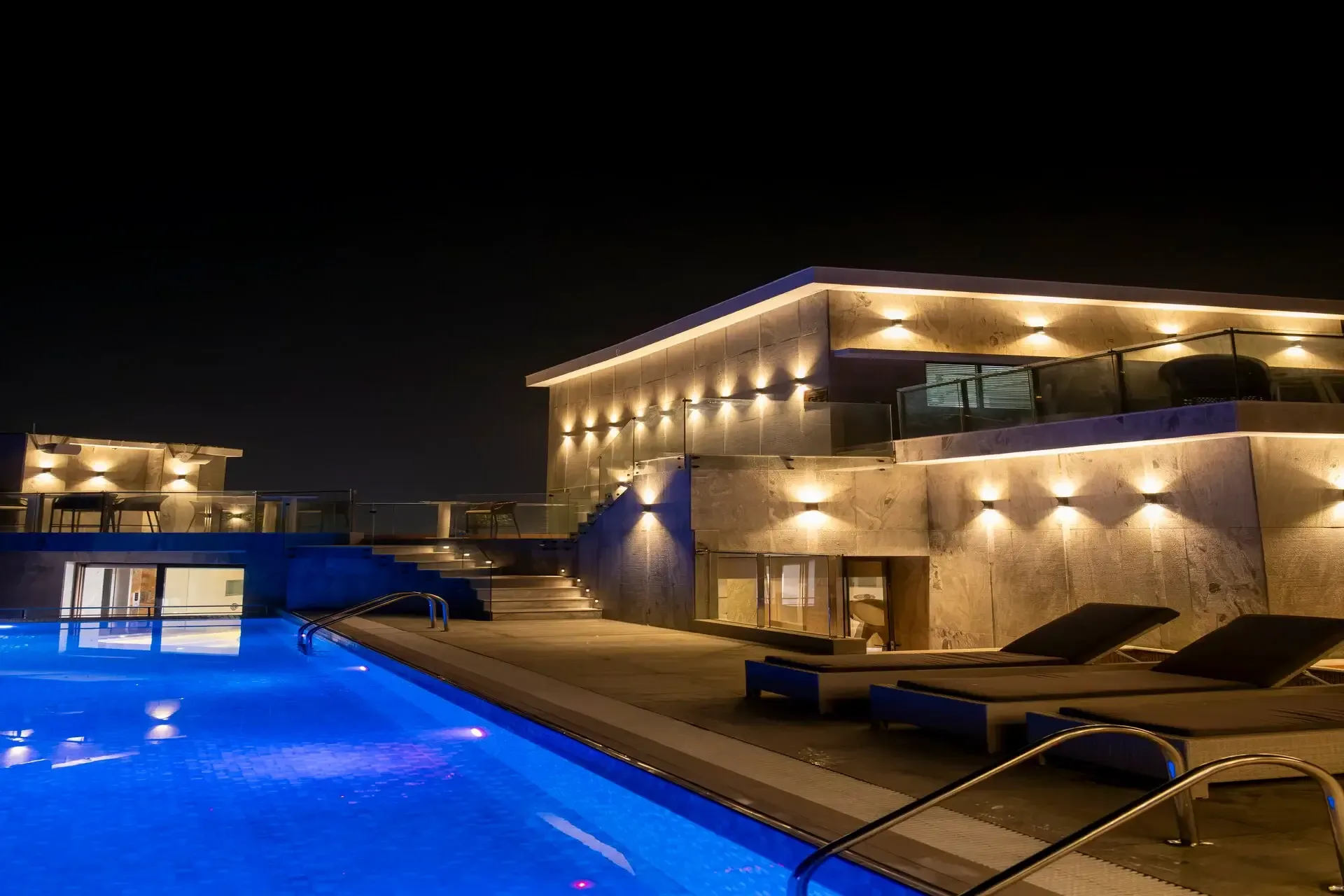 Rooftop pool lit at night at Ramada by Wyndham Cox's Bazar