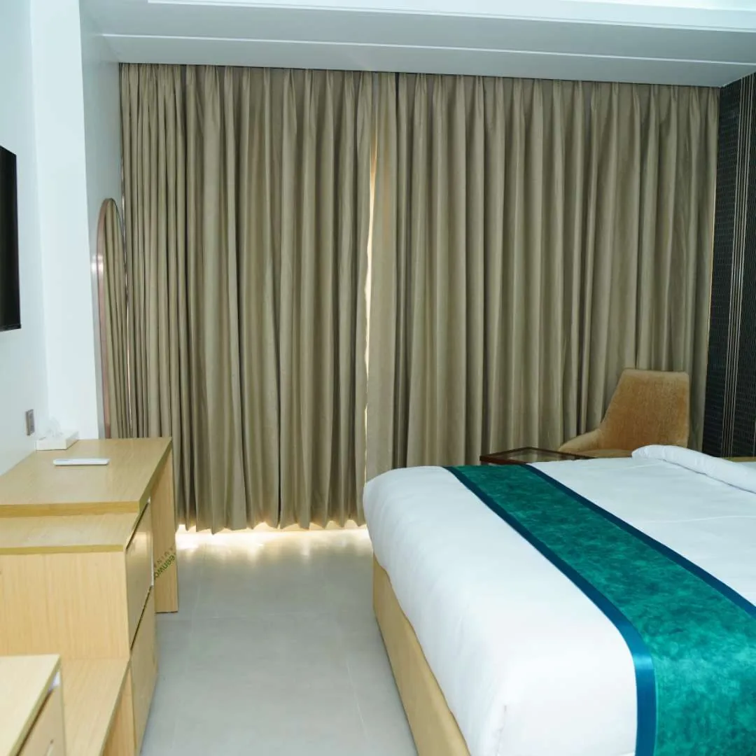 Royal Deluxe couple room with a teal bed runner