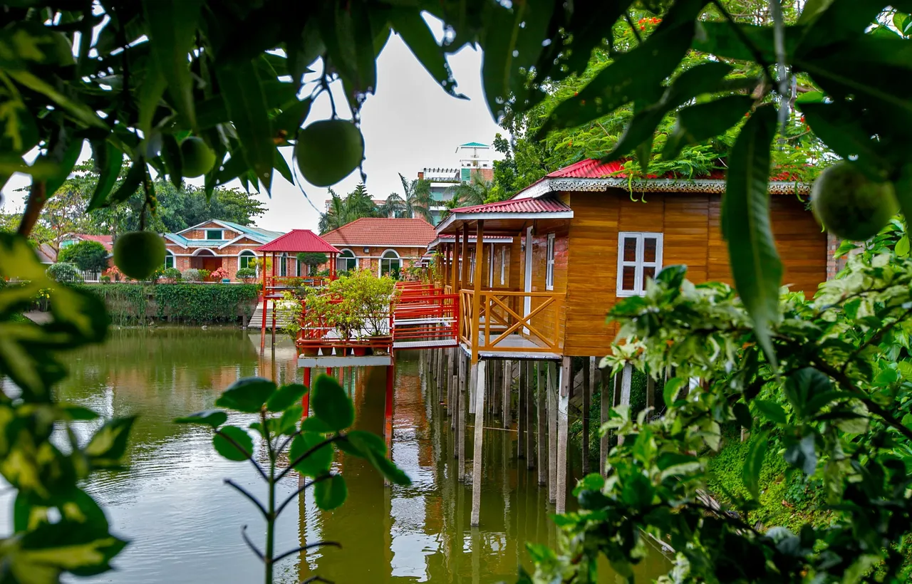 Wooden stilt cottages beside the lake at Shaira Garden Resorts