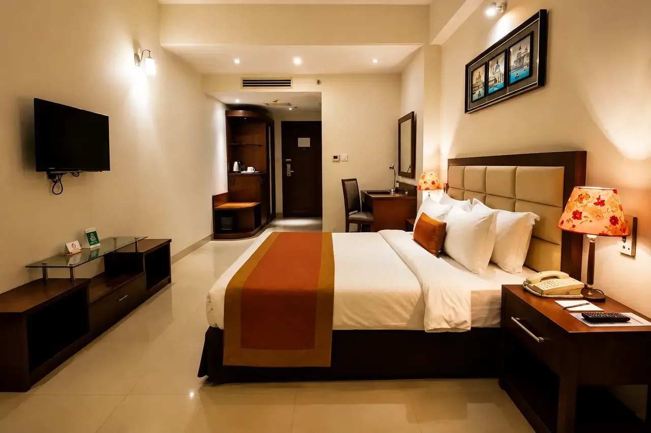 Superior king room with a large bed and wall-mounted TV