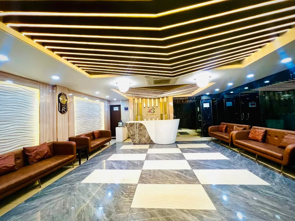 Lobby with marble floor and sofas at Hotel Sonar Bangla